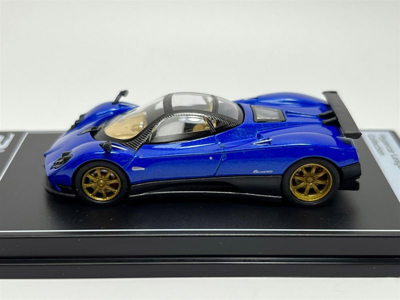 a blue toy car on a black stand