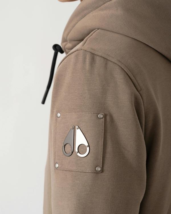 logo detail of a Moose Knuckles Classic Bunny 3 Mens Fleece Hoodie in Ashen 2019
