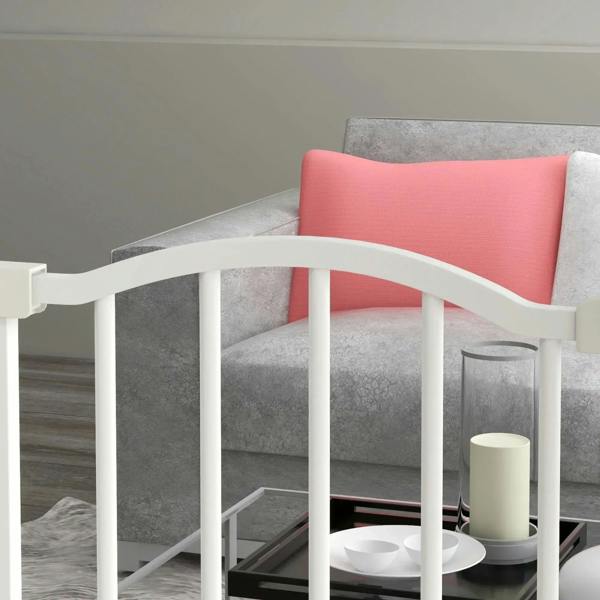 White dog safety gate with vertical bars and curved top, fitted at room entrance