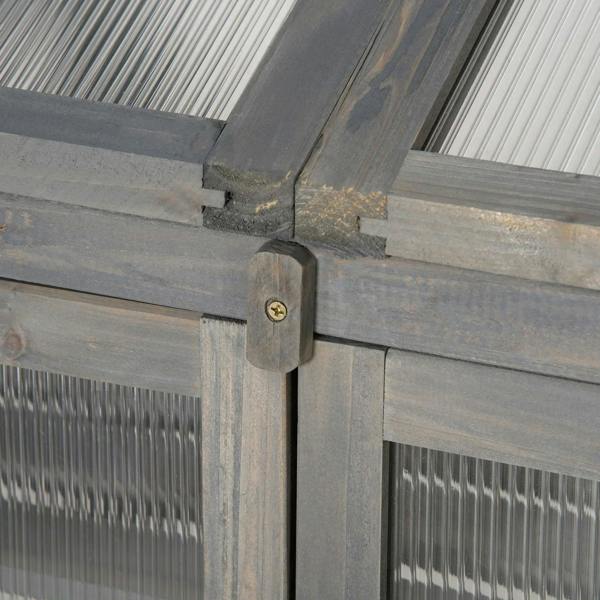 Grey wooden greenhouse corner hinge and door latch close-up