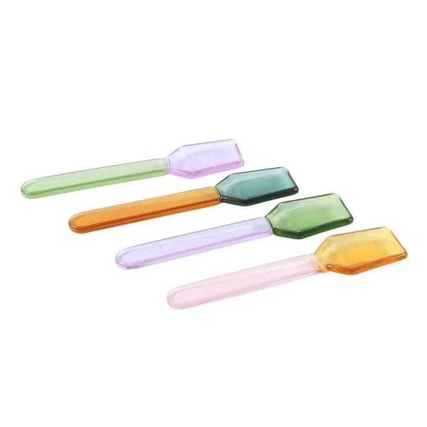 Pastel glass dessert spoons with faceted bowl heads in purple, teal, green, and amber