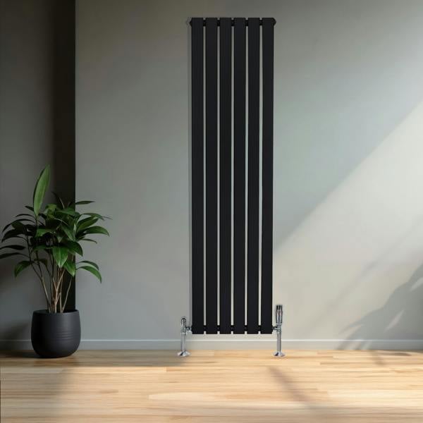 Flat black single column radiator, 1600 x 420mm, featuring sleek vertical lines and chrome valves, set against a minimalist interior with a plant