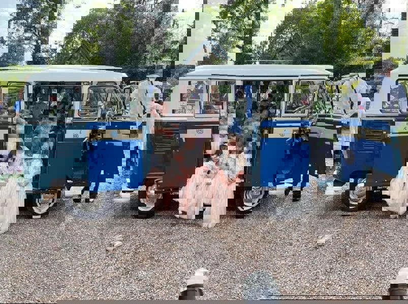 Flower girls and babies in camper van for wedding 