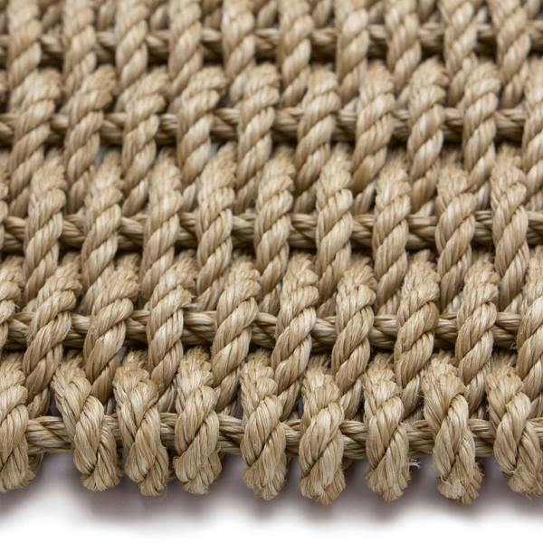 Close-up of braided jute rope on a white background