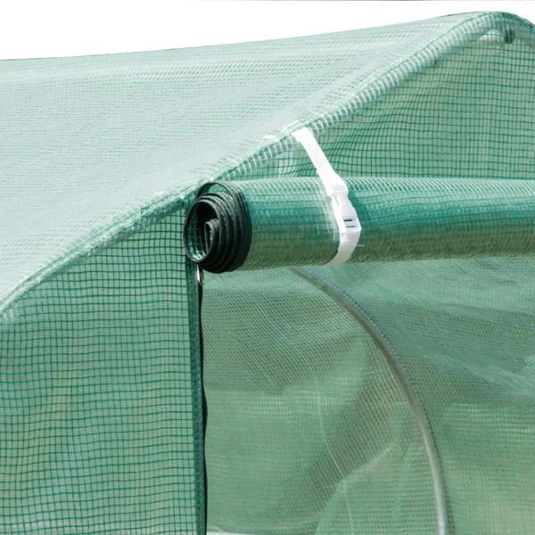 Green polytunnel greenhouse frame tube with secured PE cover fabric edge detail