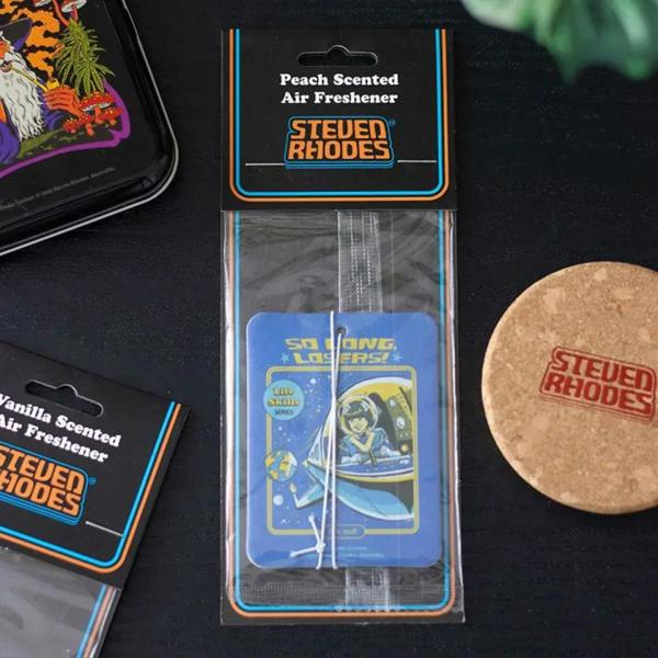 Peach scented air freshener pack by Steven Rhodes with blue tag and round disc