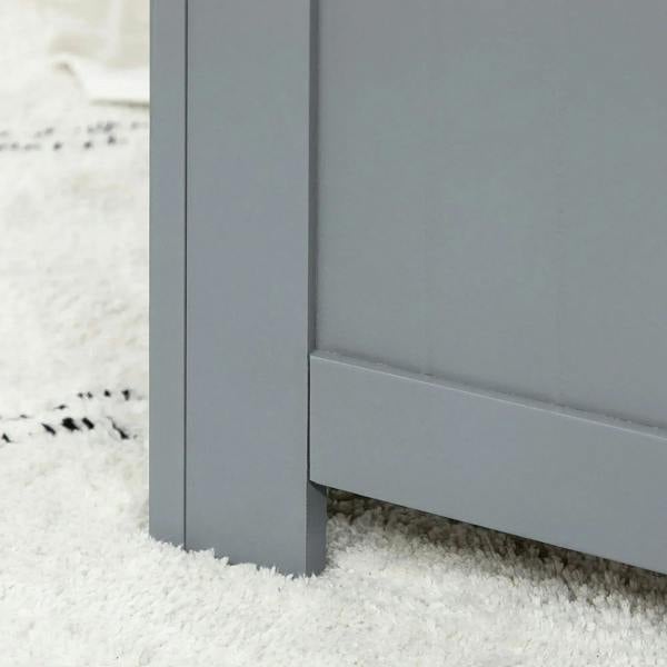 Grey toy chest cabinet with small clearance feet on a carpeted floor