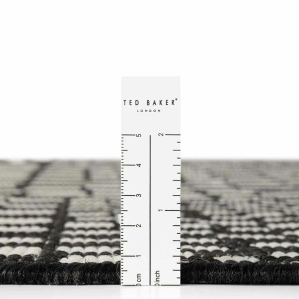 Ted Baker London rug with a ruler for scale on a white background