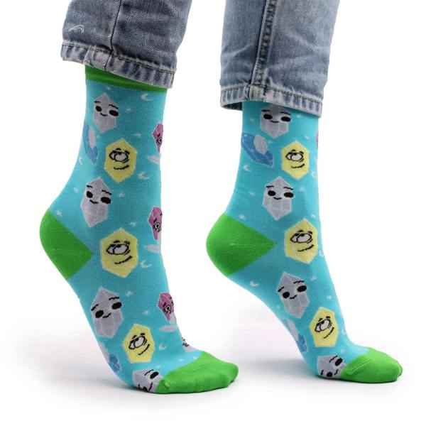 Hop Hare bamboo crew socks on denim legs, turquoise with green toe and gemstone character print