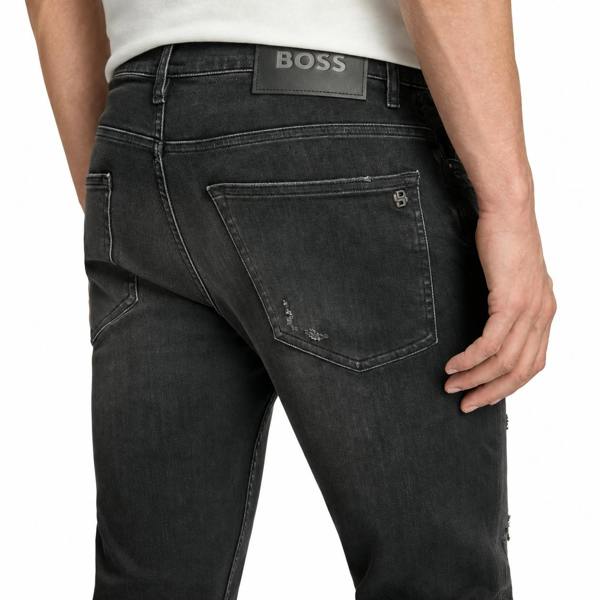 BOSS Delaware slim fit jeans in dark grey with distressed details and a branded black leather back patch.