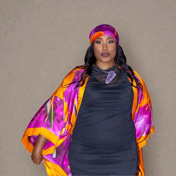 Women's Bird of Paradise Pink Purple Plus Size and Mid Size Silk Kimono styled with the Boudicca Black Dress for an elegant look.