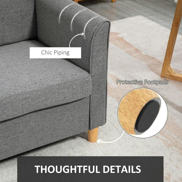 Grey loveseat sofa with piped armrest and protective footpads on wooden legs