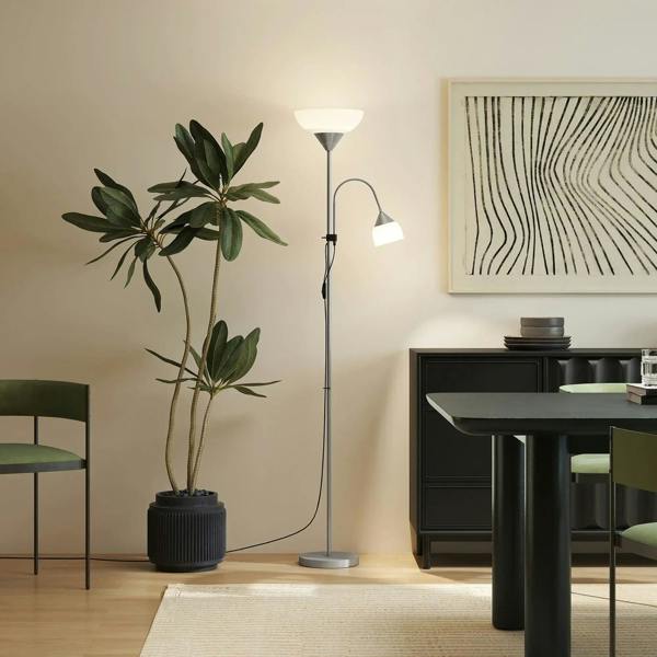 Silver floor lamp with wide top bowl shade and adjustable side spotlight on round base.