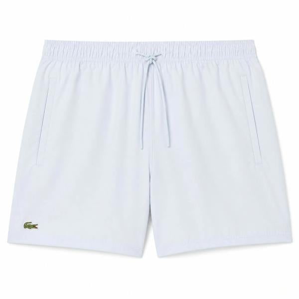 Lacoste light blue quick-dry swim shorts with drawstring waist and green crocodile logo.