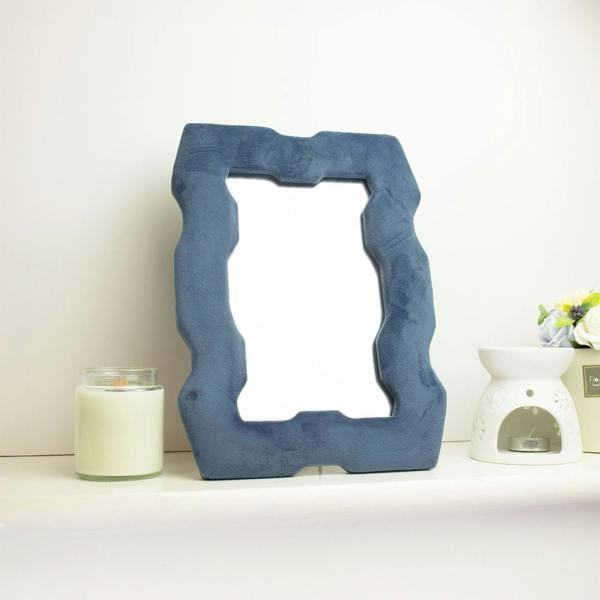Royal blue chunky squiggly framed mirror with square cutout center