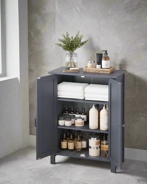 Bathroom floor cabinet with beadboard-style doors and silver knobs

