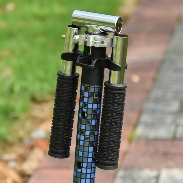 Close-up of blue patterned handlebar stem and textured grips on kids kick scooter