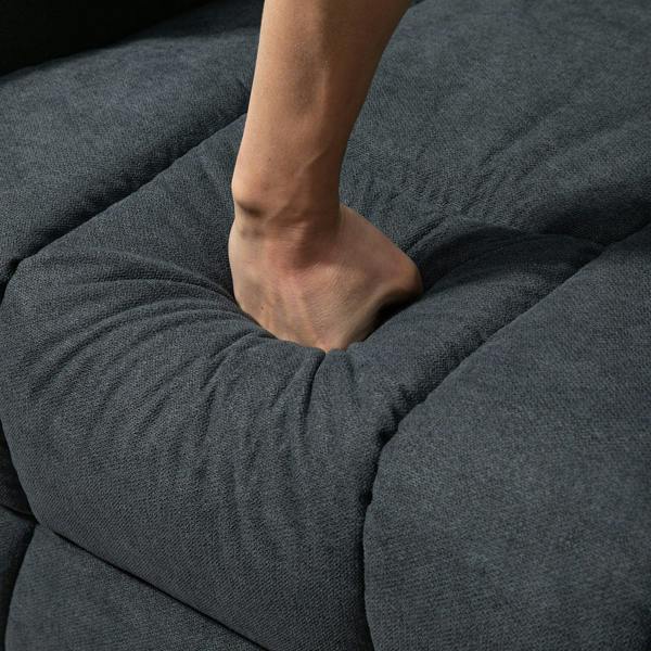 Charcoal dark gray recliner armchair upholstery close-up with padded seat detail