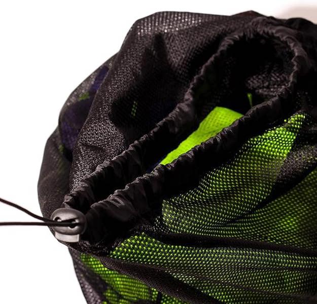 Close-up of open black mesh Optimum bib bag with green bibs inside and drawstring cord, on white - Optimum