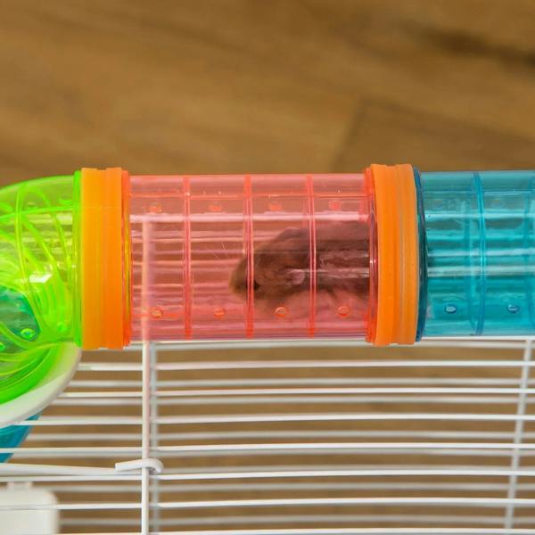 Close-up of colorful tube connection on a white wire hamster cage