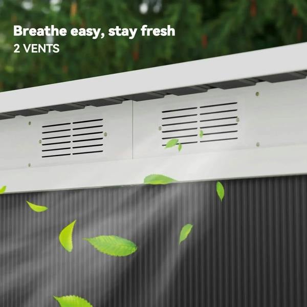Shed roof with two vent grilles over dark grey metal wall panels