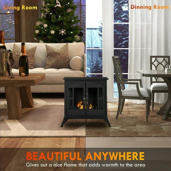 Black freestanding bioethanol stove in living room with flame burning