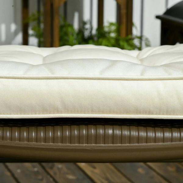 Cream seat cushion pad with smooth base and visible seams on chair