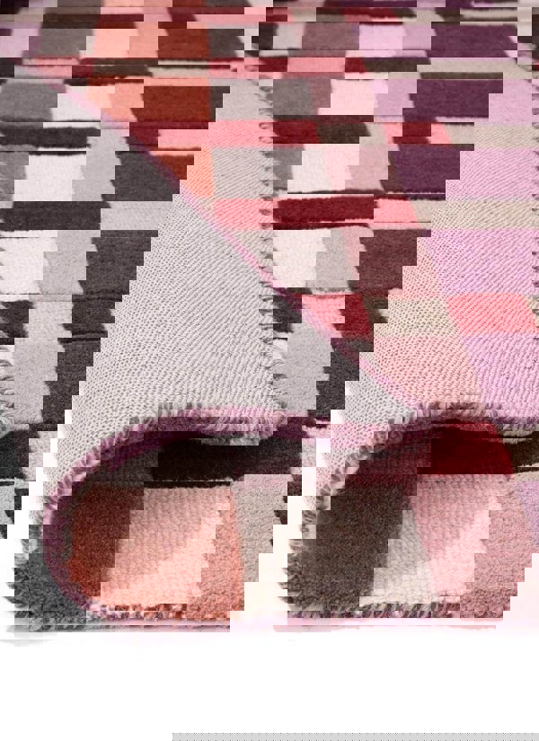 Hand-carved multicolour geometric wool rug showcasing texture and block design, ideal for modern interiors.