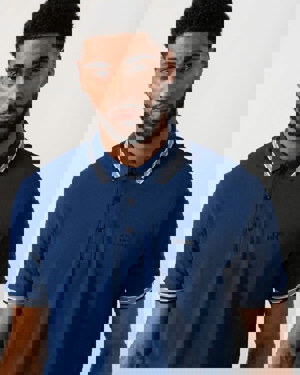 Model wearing BOSS Green Mens Paddy Cotton-Piqué Polo Shirt with Contrast Logo in Navy 419 - Detail