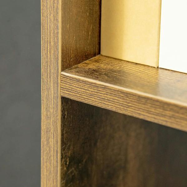 Close-up of brown wood-grain shelf edge and inner cubby surface