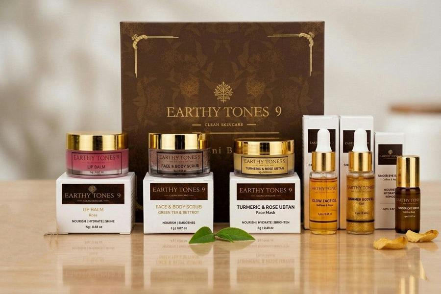 Earthly Tones 9 skincare products gift box including jars, bottles, and a box.