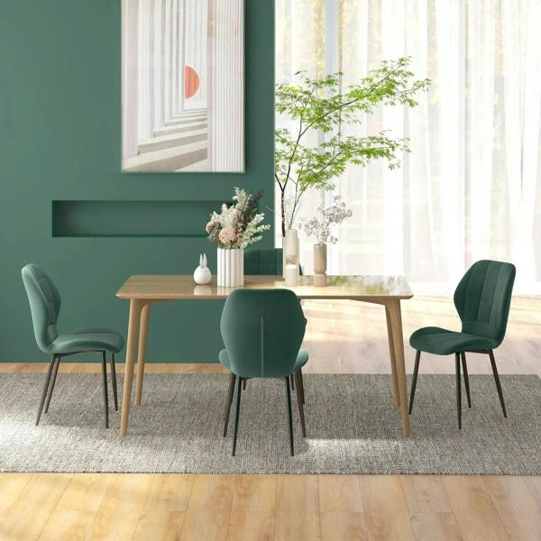Emerald green flannel dining chair with quilted back and cushioned seat at a wooden table