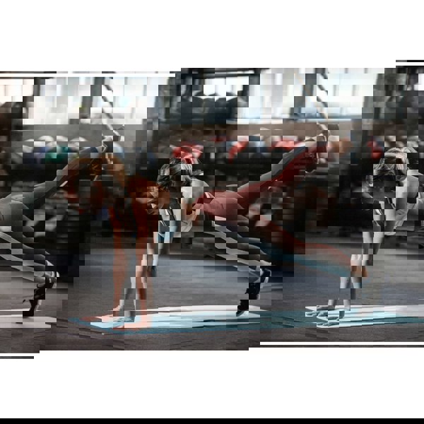 Woman in exercise class using a Reebok Love Fitness Mat - Blue