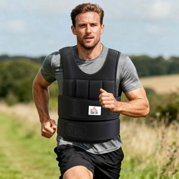 Black adjustable weight vest worn outdoors, padded front and adjustable waist belt