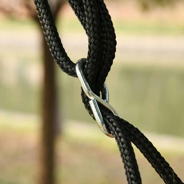 Silver steel connector on black braided suspension rope for hanging swing
