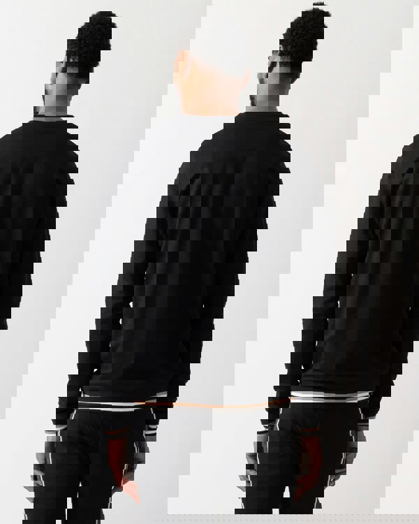 Back shot of a Model wearing a BOSS Orange Mens Iconic Loungewear Sweatshirt in Black