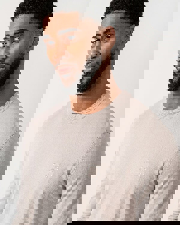 detail shot of a model wearing a BOSS Orange Kanovano Mens Crew Neck Jumper in Open Grey