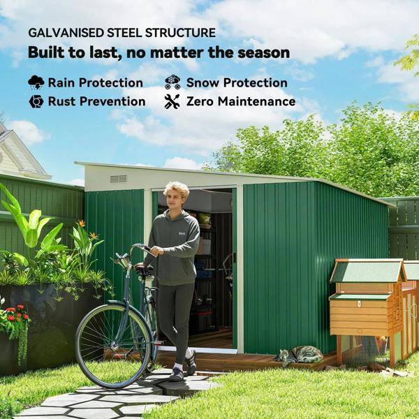 Green metal storage shed with wide double sliding door open for outdoor items