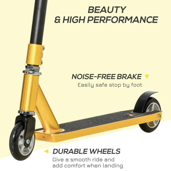 Gold and black stunt scooter close-up of front wheel, fork, and foot brake