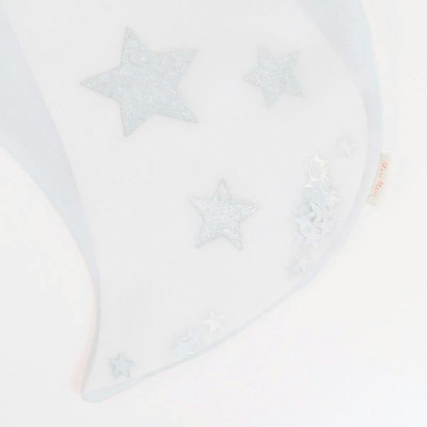 Close-up of chunky silver glitter stars and metallic star sequins inside white organza trick or treat bag