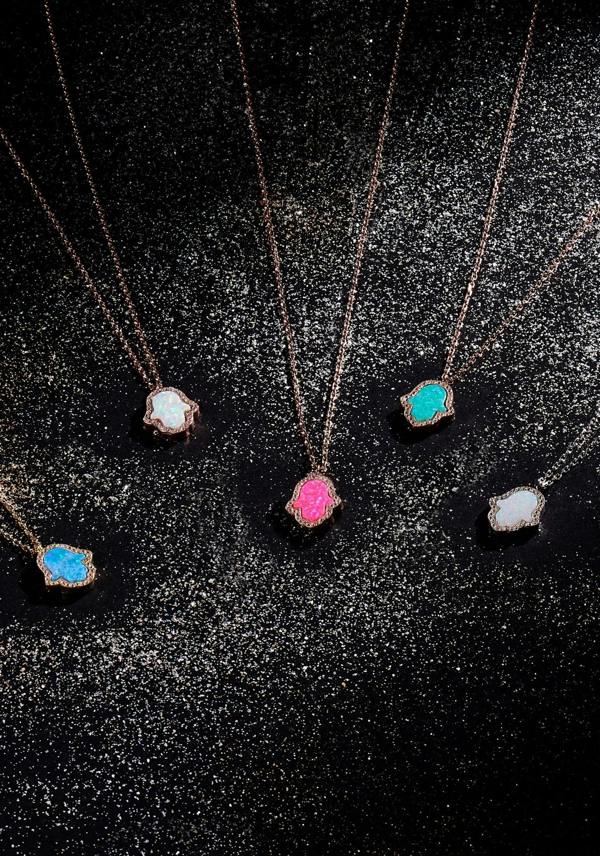 Hamsa hand necklaces with different opal and metal variants.