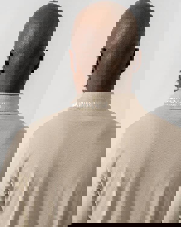 Model wearing Emporio Armani Mens Beach Polo in Taupe - Back 