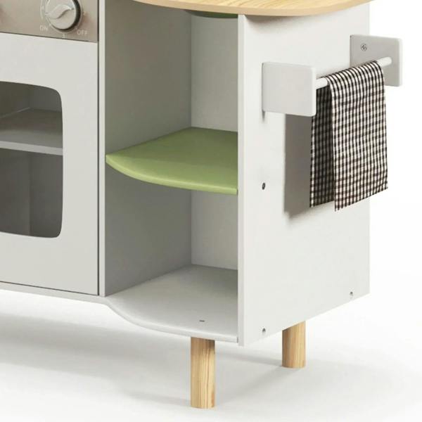White cabinet with green shelf and hanging black-and-white checkered towel on side hook
