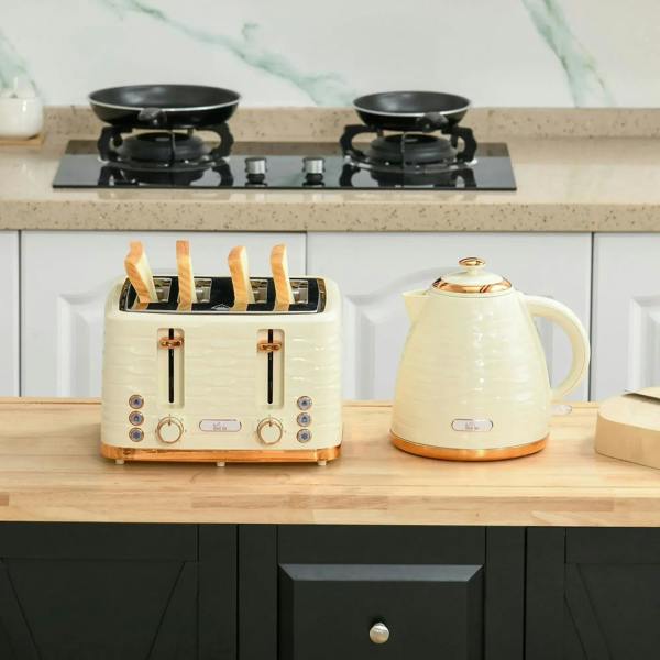 Beige kettle and 4-slice toaster set on wooden counter with copper accents