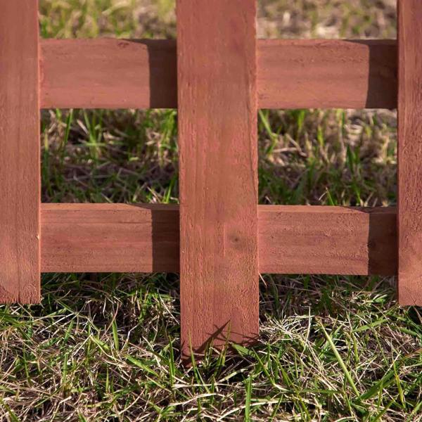 Rustic brown wooden fence base with vertical stakes and three horizontal rails
