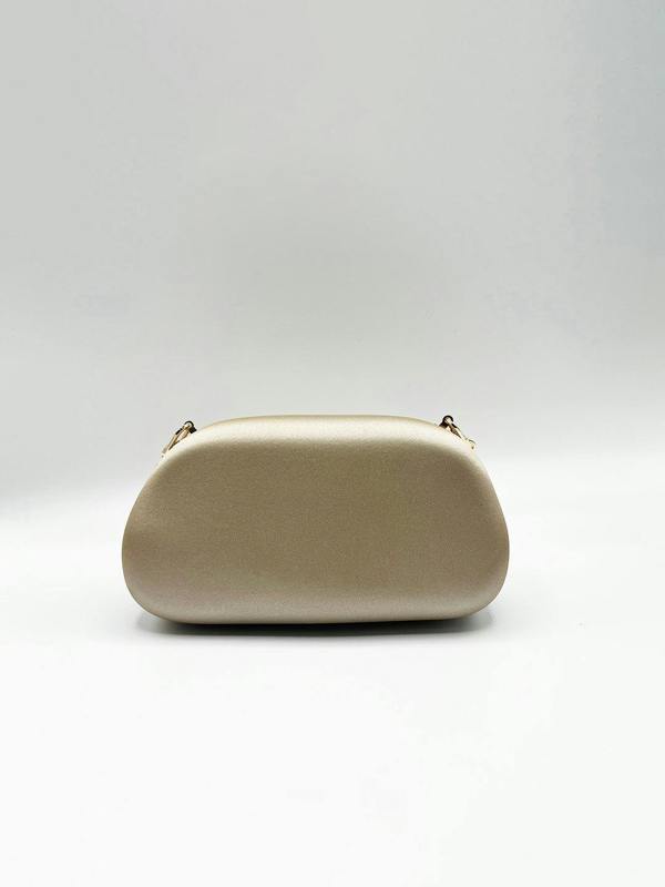 Oval Satin Hard Case Clutch Bag In Muted Gold - svnx