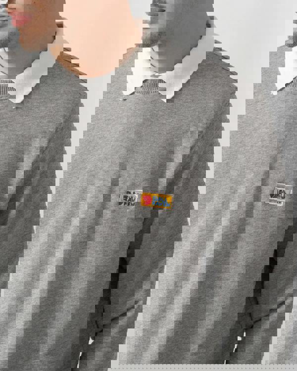 close up shot of a model wearing a Fjallraven Vardag Mens Sweater in Grey Melange 020-999
