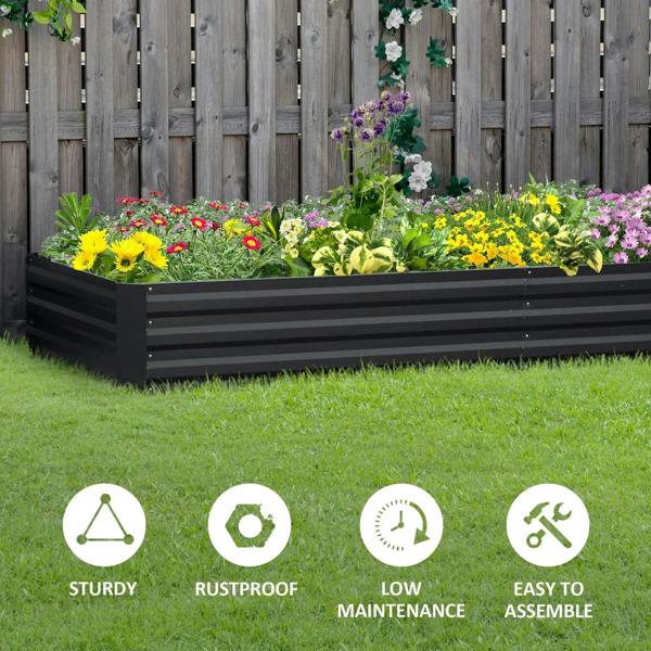 Outdoor metal raised garden bed planter box in dark grey with blooming flowers inside