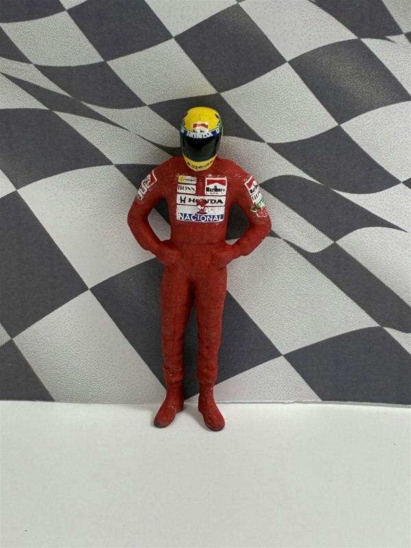 a toy figure in a red uniform