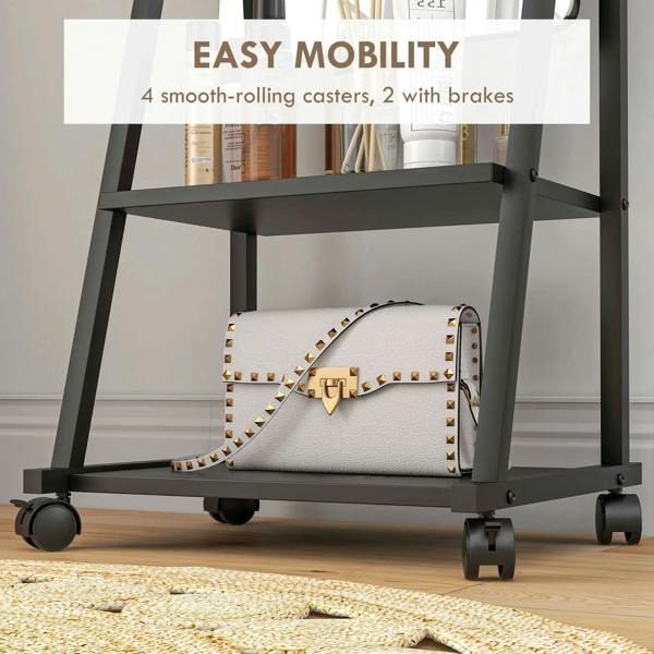 Black rolling dressing mirror showing bottom shelf and four casters with brakes
